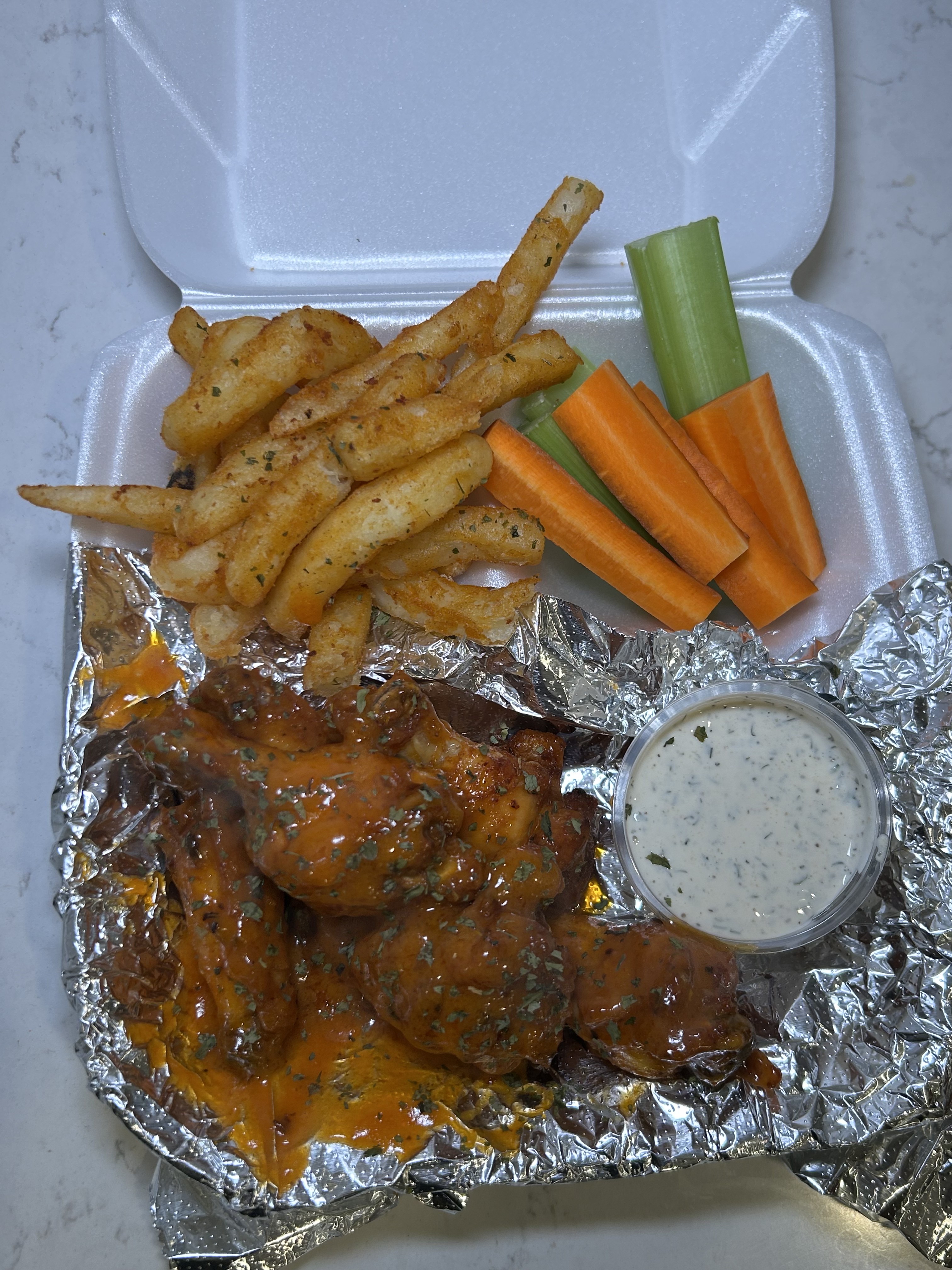 Real BBQ Addiction Wings with fries, vegetables, and ranch